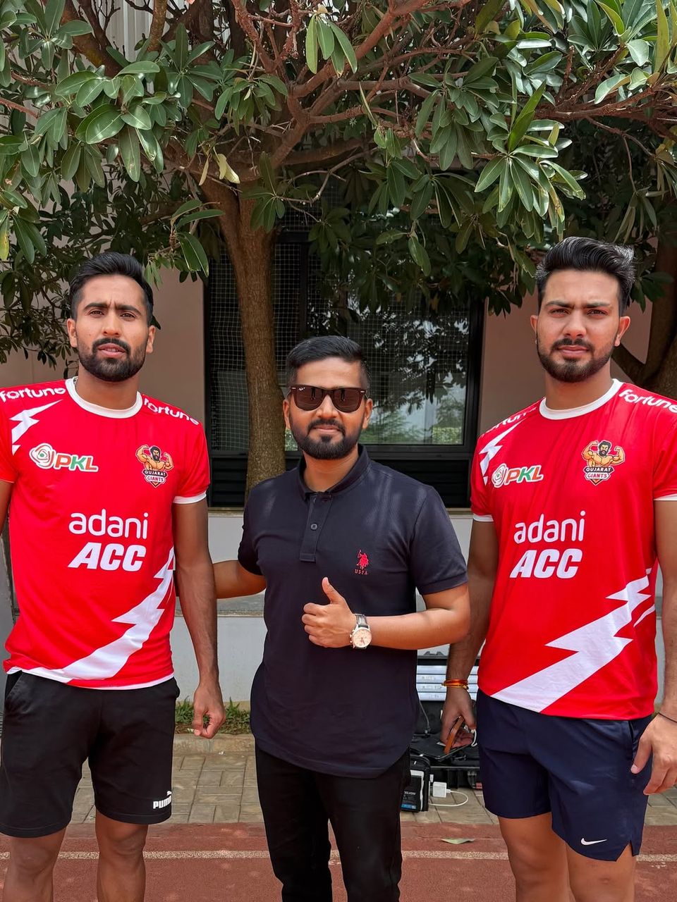 Akshay with a sports team at a corporate event
