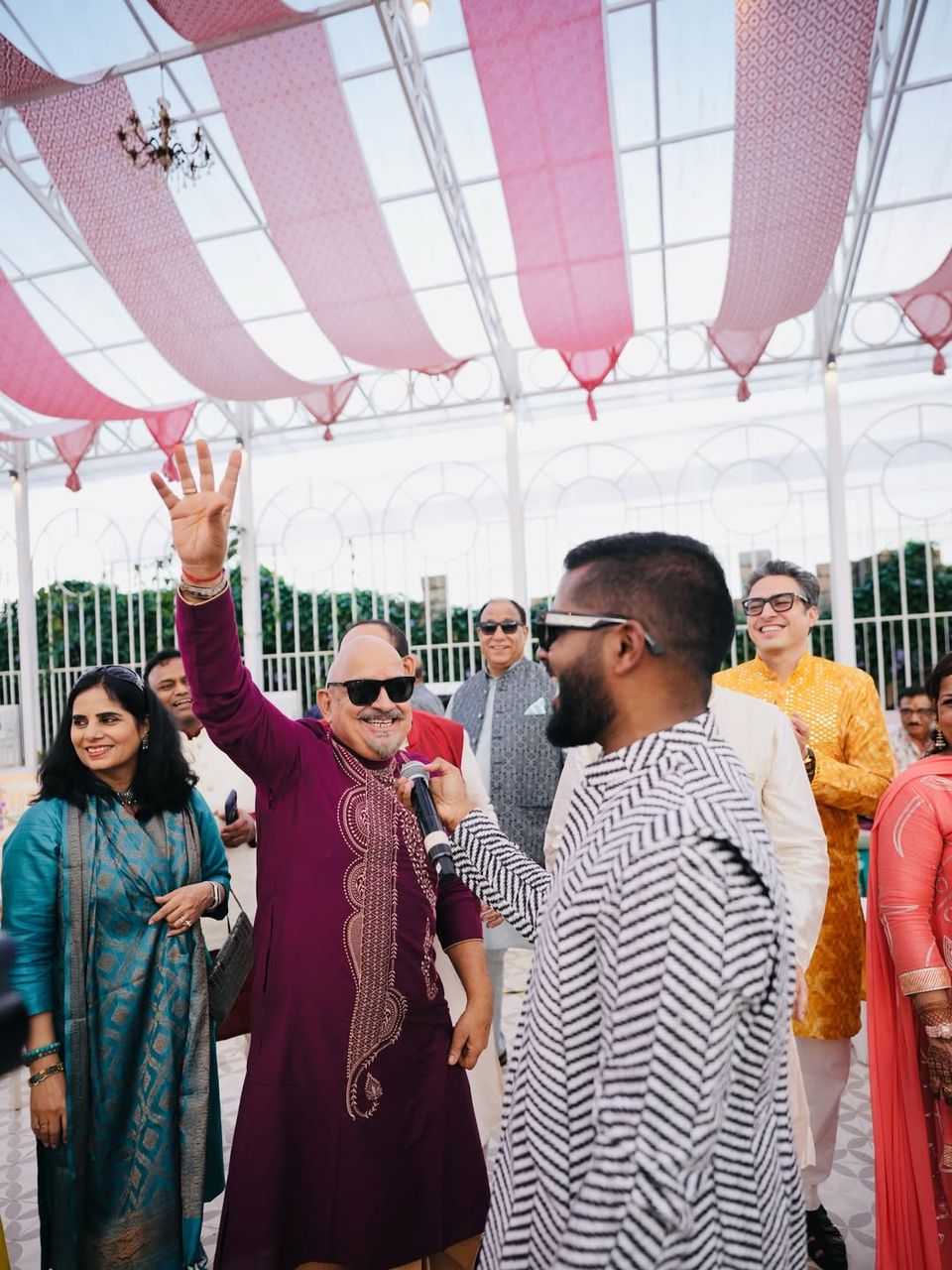 Guests cheering at a haldi