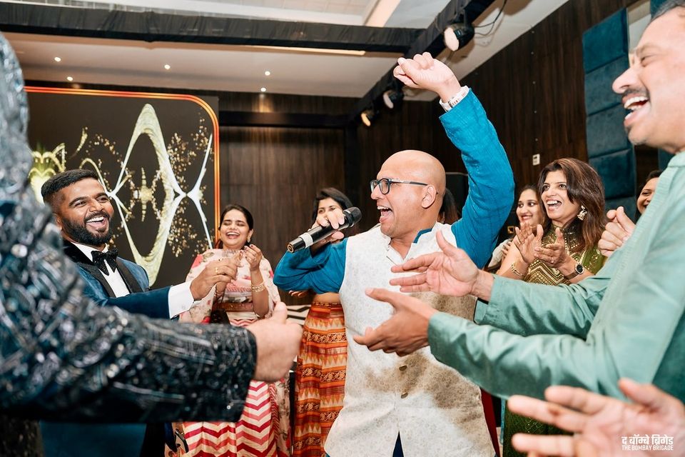 Akshay dancing with guests at a sangeet